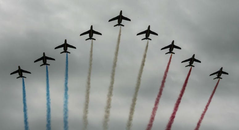 French Air Force aerial demonstration team, conducts a flight over Iron Mike Drop Zone, outside of Saint-Mere-Eglise. Over 1,000 U.S. paratroopers participate in largest airborne operation since WWII to commemorate 75th anniversary of D-Day.