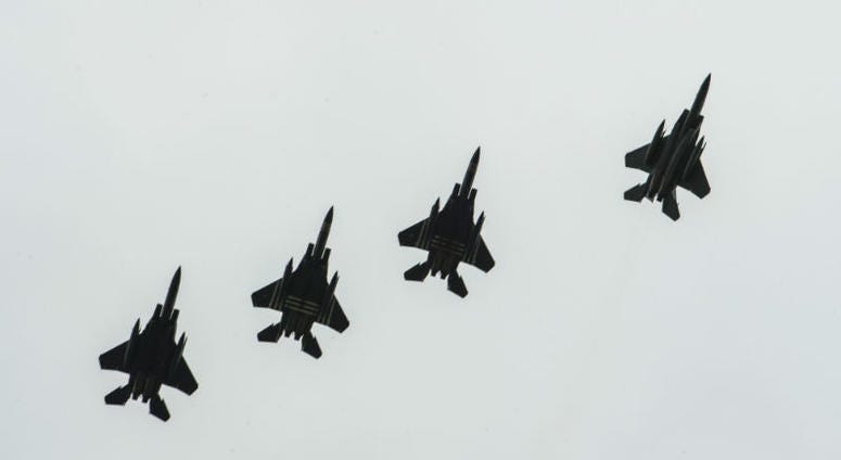 Four F-15E Strikes Eagles, assigned to the 48th Fighter Squadron, Royal Air Force Lakenheath, England,conduct a fighter escort for 23 aircraft dropping personnel. Over 1,000 U.S. paratroopers participate in largest airborne operation since WWII to commemorate 75th anniversary of D-Day.