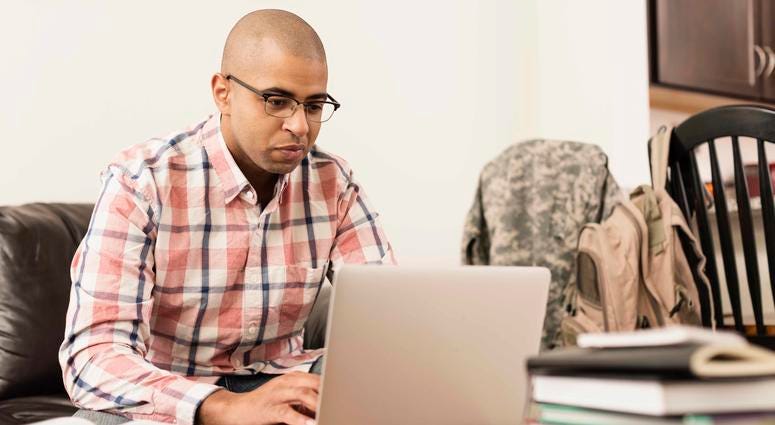 Adult student working on a computer