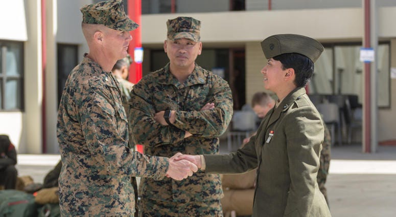 U.S. Marine Col. Jeffery Holt, commanding officer, School of Infantry - West, and Sgt. Maj. Jonathon Groth, School of Infantry - West sergeant major, greets Pvt. Nathalie Lizama, Camp Pendleton, Calif., March 6, 2018. U.S. Marine Col. Jeffery Holt, commanding officer, School of Infantry - West, and Sgt. Maj. Jonathon Groth, School of Infantry - West sergeant major, greets Pvt. Nathalie Lizama, Camp Pendleton, Calif., March 6, 2018.