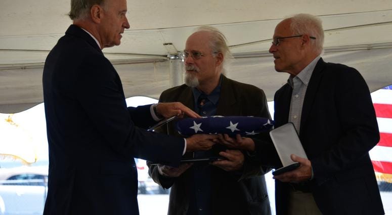 Massachusetts U.S. Representative Bill Keating presented Stephen and Bradley Finch with an American flag