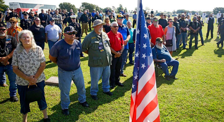 Mourners attend a funeral service for World War II veteran Herman White