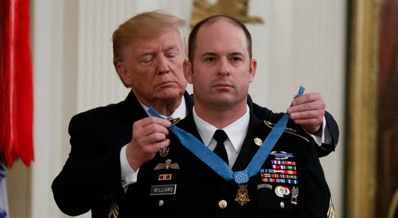 President Donald Trump places the Medal of Honor on Army Master Sgt. Matthew Williams, currently assigned to the 3rd Special Forces Group, during a Medal of Honor Ceremony in the East Room of the White House, President Donald Trump places the Medal of Honor on Army Master Sgt. Matthew Williams, currently assigned to the 3rd Special Forces Group, during a Medal of Honor Ceremony in the East Room of the White House,