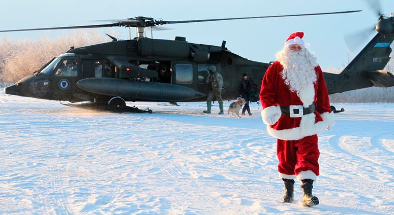 This Dec. 3, 2019 photo shows Santa Claus arriving in Napakiak, Alaska, on an Alaska National Guard UH-60 Black Hawk helicopter. This Dec. 3, 2019 photo shows Santa Claus arriving in Napakiak, Alaska, on an Alaska National Guard UH-60 Black Hawk helicopter.