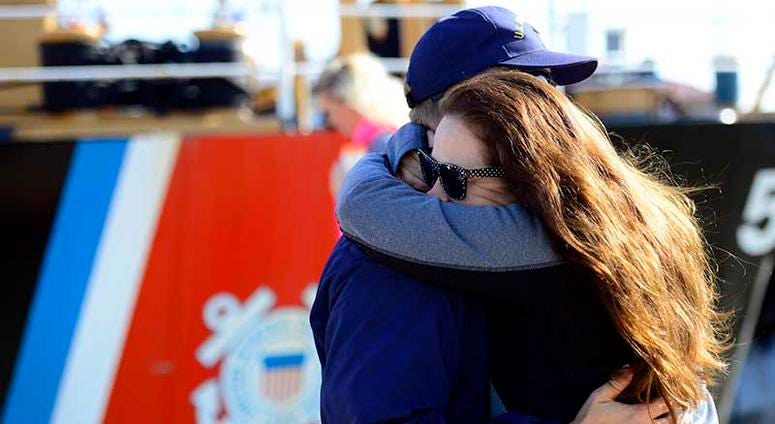 A Coast Guard Cutter Dauntless crew member greets his loved one after a 60-day patrol in the Gulf of Mexico on April 22, 2018 in Galveston, Texas. This marks the last time Dauntless will return from patrol to Galveston before shifting her homeport to Pens