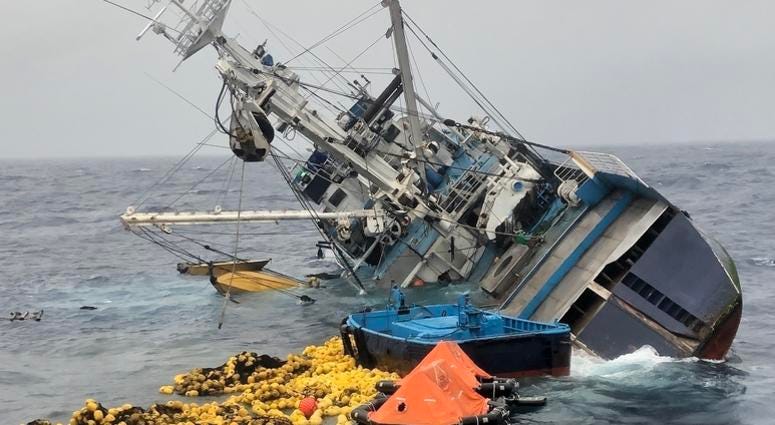 Fishing nets, life rafts, and debris from the 160-foot Ecuadorian fishing vessel Marujita float behind the capsizing vessel approximately 336 miles southeast of Clipperton Island, August 7, 2019. Twenty five crew members and 12 Coast Guardsmen who abandon Coast Guard rescues 37 people after fishing boat capsizes, sinks in the Eastern Pacific Ocean