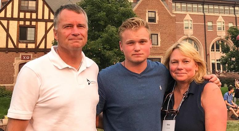Retired Navy Adm. James Winnefeld (L), Jonathan (C), and Mary Winnefeld (R)