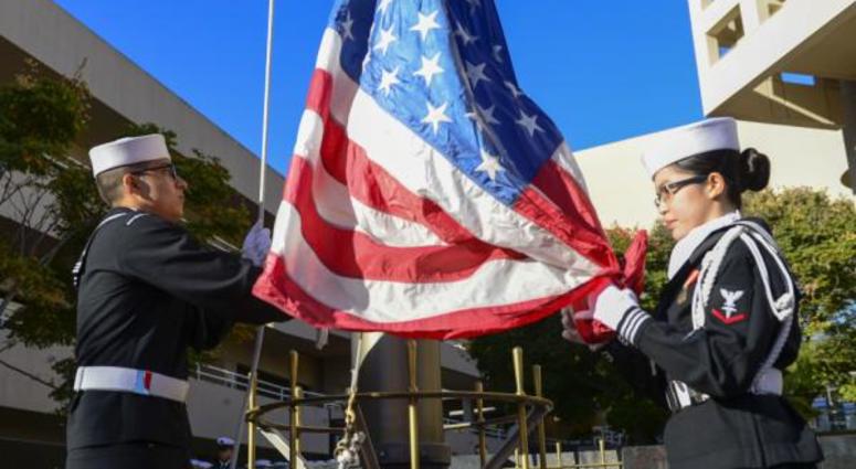 U.S. Navy photo by Mass Communication Specialist Seaman Harley K. Sarmiento Sailors assigned to Naval Medical Center San Diego (NMCSD), raise the flag during a special morning colors in observance of Veteran’s Day.