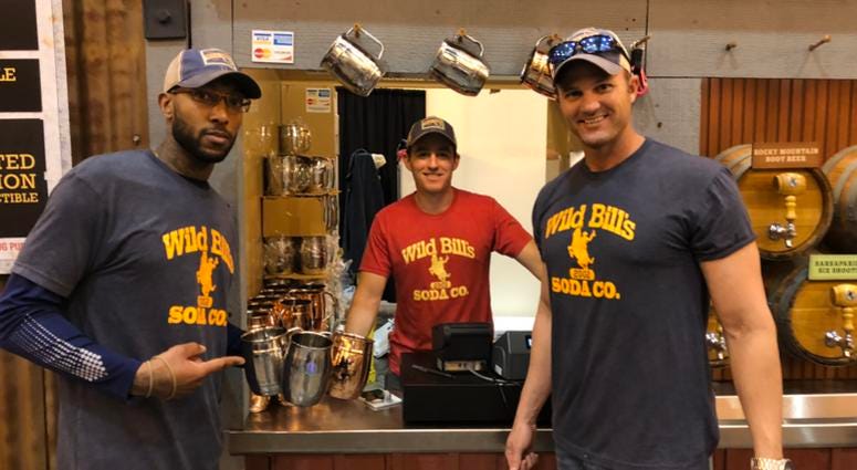 Marine Corps vets Courtney Brown, James Ferguson and Josh Frasier of Wild Bill's Soda at an event. (l-r) Marine Corps veterans Courtney Brown, James Ferguson and Josh Frasier of Wild Bill's Soda