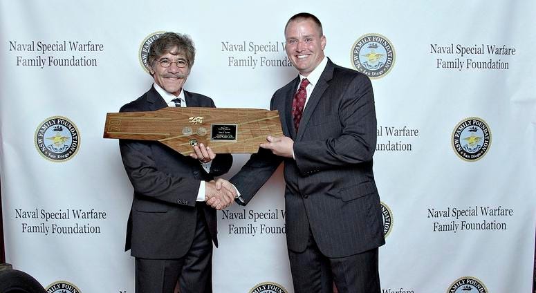 Kyle Nyseth presents a custom-made plaque to Geraldo Rivera