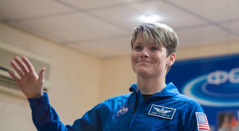 Expedition 58 Flight Engineer Anne McClain of NASA waves during a press conference on December 2, 2018 at the Cosmonaut Hotel in Baikonur, Kazakhstan. Astronaut