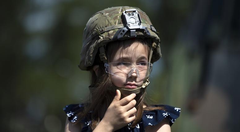 Gold Star family member Jamie Nolen wears a soldier’s helmet while visiting Fort Bragg, N.C. with NASCAR driver Ryan Newman April 17, 2019. Jamie Nolen is the daughter of Sgt. James Nolen, who died while serving in Afghanistan in 2009. GoldStarFamily