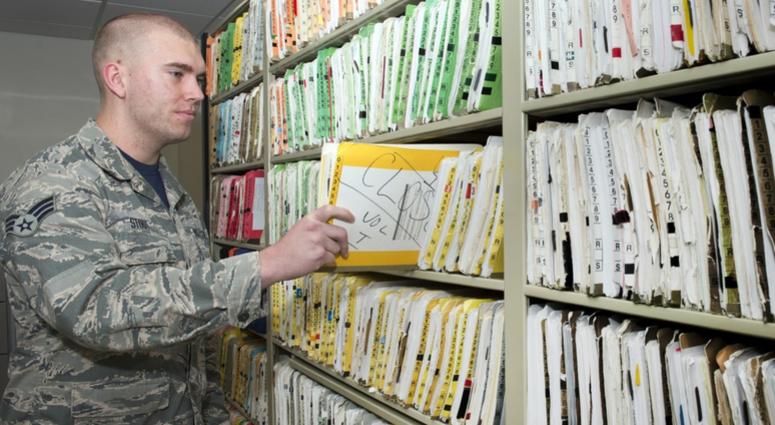 Senior Airman Devon Stout, 66th Medical Squadron health care management technician, completes a quality check of an outpatient medical record at the clinic Oct. 20. Healthrecords