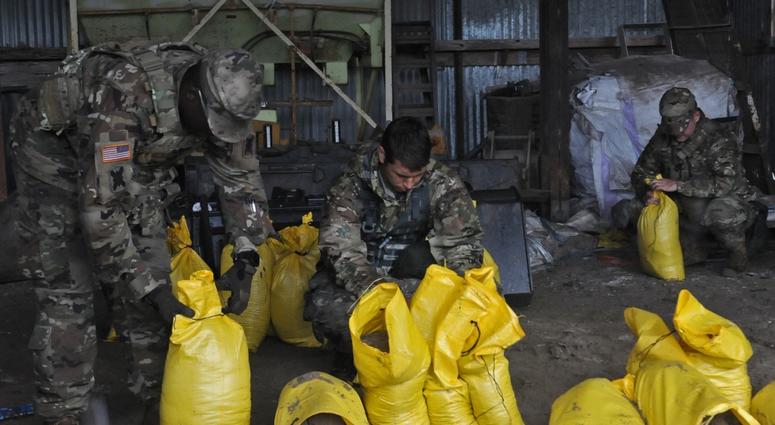 Louisiana National Guardsmen with 2nd Battalion, 156th Infantry Regiment, 256th Infantry Brigade Combat Team, fill sand bags in Morgan City, Louisiana, as Hurricane Barry moves in, July 13, 2019. HurricaneBarry