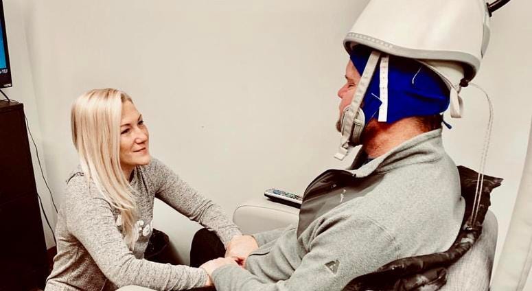 Virago founder Jen Satterly holds her husband Toms hands as he goes through medical treatment Jen Satterly founder of Virago and her husband Tom a retired Army Delta Force Command Sergeant Major