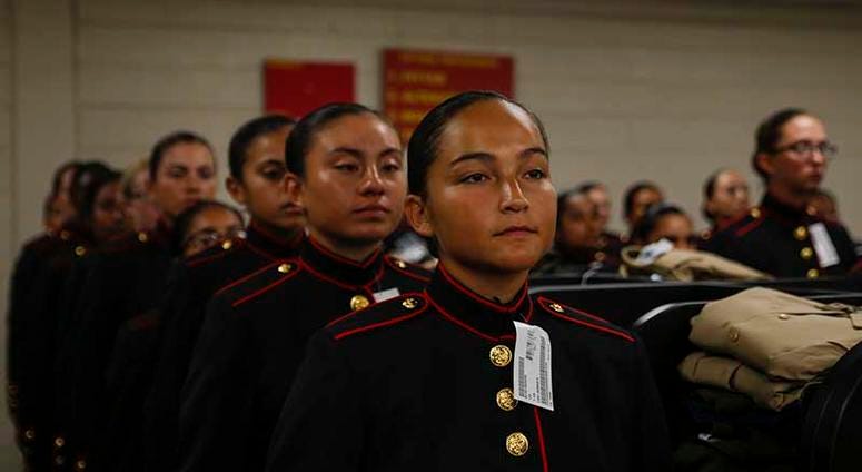 Recruits with Platoon 4040, Papa Company, 4th Recruit Training Battalion, try on their blue dress coats for the first time Aug. 21, 2018, on Parris Island S.C. The recruits are part of the first female company to be issued the new female blue dress coat,