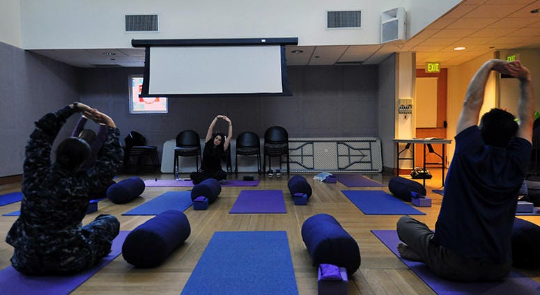 160226-N-BB534-340 SAN DIEGO (Feb. 26, 2016) Attendees at the Military and Veteran Resiliency Medicine Summit participate in yoga during a hands-on skill workshop. The summit was held at Naval Medical Center San Diego (NMCSD) for civilian and military hea
