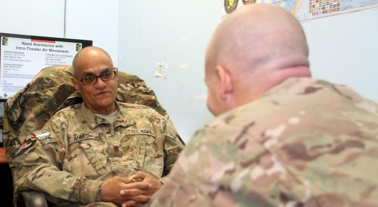 Lt. Cmdr. Mahmoud Ahmed, a Navy psychiatrist, speaks with a patient at the NATO Role III Multinational Medical Unit on Kandahar Airfield, Afghanistan in 2015. Psychiatrist