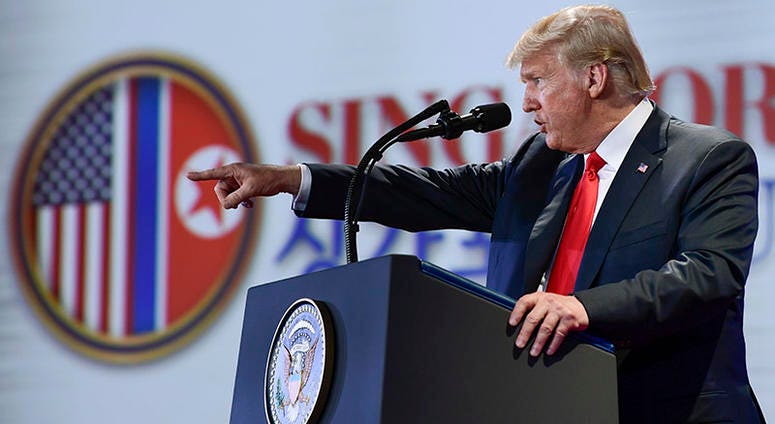 U.S. President Donald Trump answers questions about the summit with North Korea leader Kim Jong Un during a press conference at the Capella resort on Sentosa Island Tuesday, June 12, 2018 in Singapore.