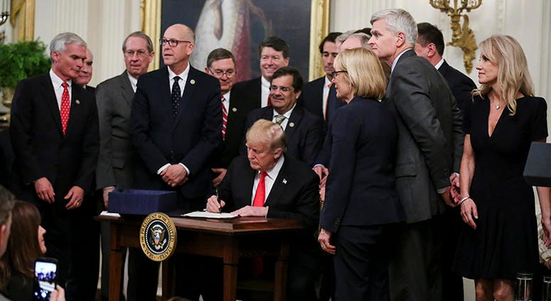 President Donald Trump sings the new opioid bill into law in the East Room of the White House on October 24, 2018 in Washington, DC.
