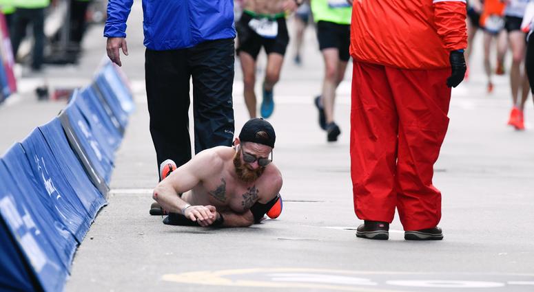 Micah Herndon crawls to the finish line of the 2019 Boston Marathon. MicahHerndonBostonMarathon