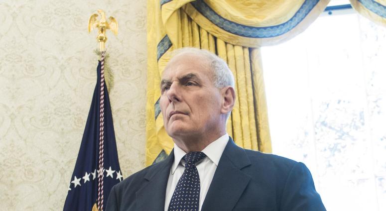 White House Chief of Staff John Kelly listens as President Donald Trump speaks to the media in the Oval Office on Oct. 19 2017 john kelly