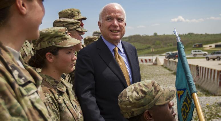 Senator John McCain poses with future graduates of the U.S. Army Basic Leader Course held on Camp Bondsteel, Kosovo, April 13, 2019. Sen. Johnny Isakson (R-Ga.) blasts Trump for his repeated attacks on the late John McCain.