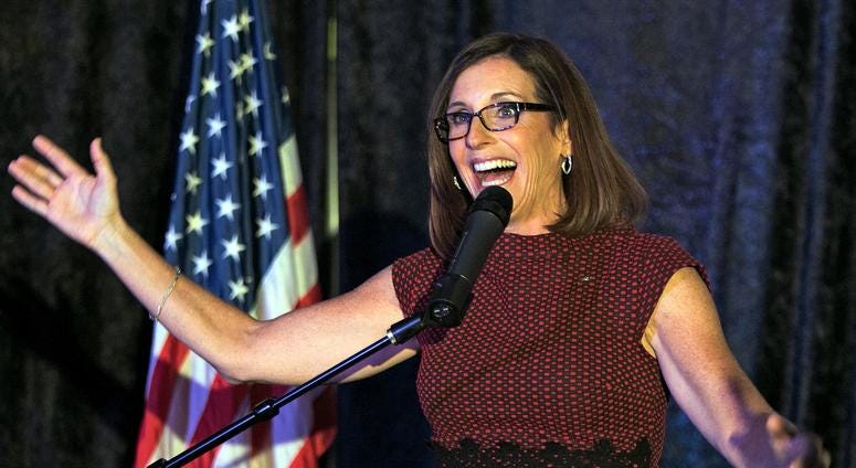 Following an opening speech to he crowd Rep. Martha McSally announces that she is off to a 6,000 vote lead early in the evening during the election night party for McSally at the Viscount Suite Hotel. mcsally