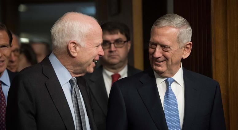 Jan 12, 2017; Washington, DC, USA; James N. Mattis, right, nominee for Secretary of Defense, arrives with Senator John McCain, R-Arizona, prior to the start of the confirmation hearing before the Senate Armed Services Committee.
