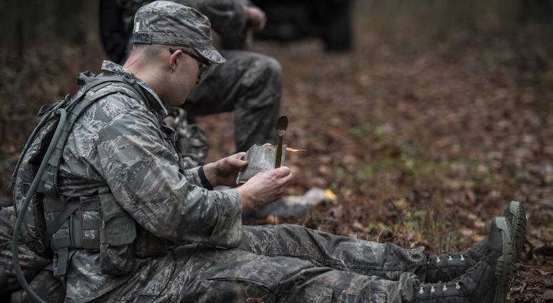 An Airman eats a Meal-Ready to Eat during a Pre Ranger Assessment Course, Feb. 10, 2018, at Moody Air Force Base, Ga. mre