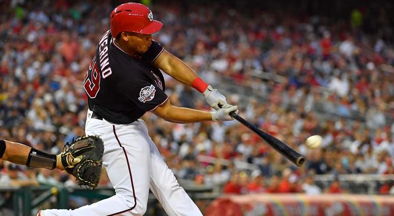 Washington Nationals catcher Pedro Severino (29) hits an RBI double against the New York Yankees during the second inning at Nationals Park.
