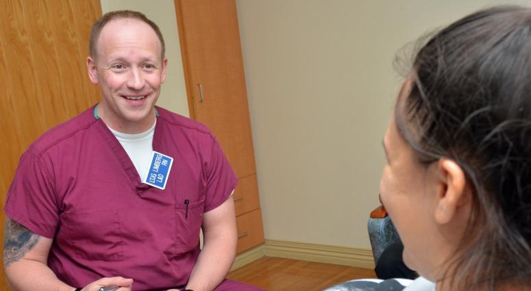 JACKSONVILLE, Fla. (March 29, 2018) Lt. j.g. Wesley Limberg, a registered nurse at Naval Hospital Jacksonville’s Labor and Delivery unit, asks Carolina Wilson questions about her pregnancy.
