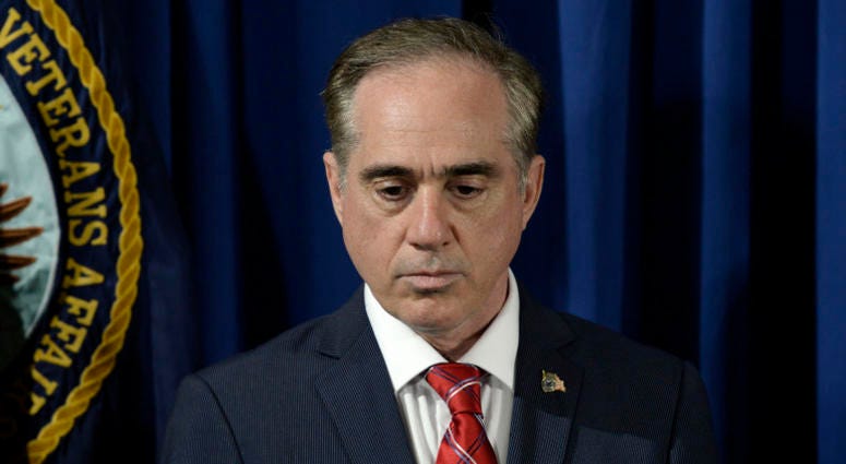 Secretary of Veterans Affairs David Shulkin listens to President Trump before signing an Executive Order on Improving Accountability and Whistleblower Protection at the Department of Veterans Affairs in Washington, DC, April 27, 2017.