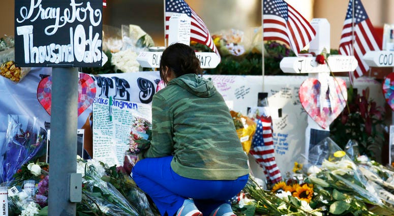 Nov. 12, 2018; Thousand Oaks, CA, USA; Visitors continue to bring flowers and leave personal messages at the mass shooting memorial