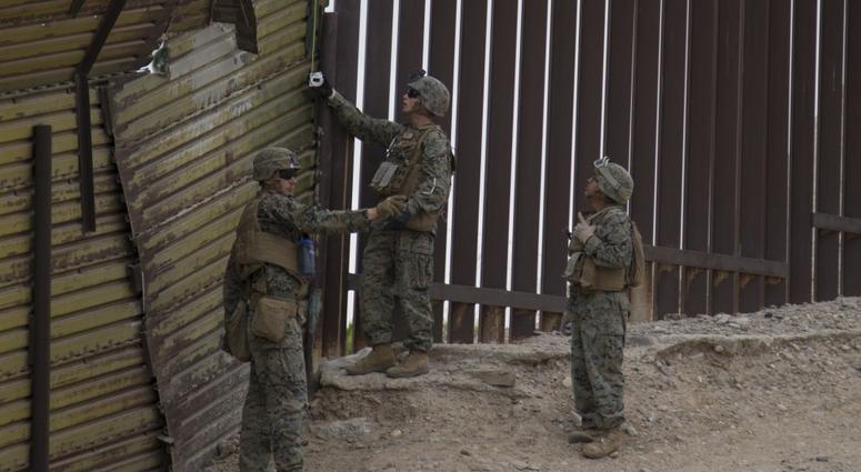 U.S. Marines attached to Special Purpose Marine Air-Ground Task Force 7 place wire near the Andrade point of entry, California, Nov. 29, 2018.