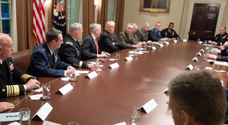 President Donald J. Trump receives a briefing from senior military leaders Tuesday, Oct. 23, 2018, in the Cabinet Room of the White House.