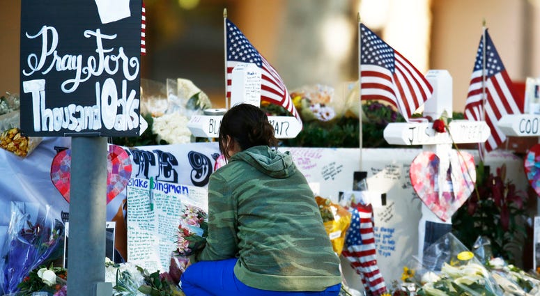 Nov. 12, 2018; Thousand Oaks, CA, USA; Visitors continue to bring flowers and leave personal messages at the mass shooting memorial
