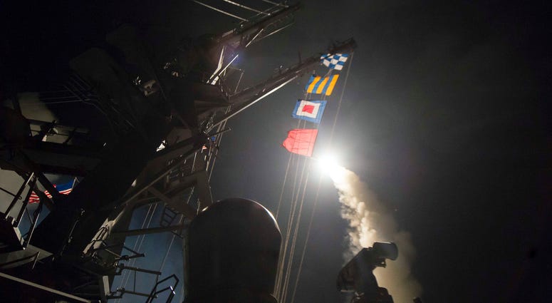 USS Ross (DDG 71) fires a tomahawk land attack missile. USS Ross, an Arleigh Burke-class guided-missile destroyer.