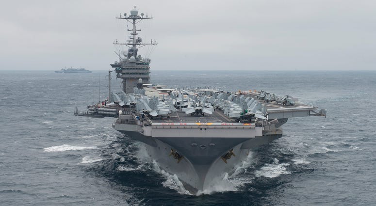 The aircraft carrier USS Harry S. Truman (CVN 75) transits the Atlantic Ocean while conducting a training unit exercise on Feb. 14, 2018.