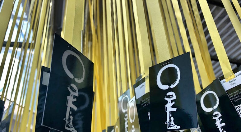 Yellow ribbons for each of the 6,964 service members killed since 9/11 hang in the Women In Military Service For America Memorial in Arlington National Cemetery as part of Mindful Memorial Day. MindfulMemorialDay2