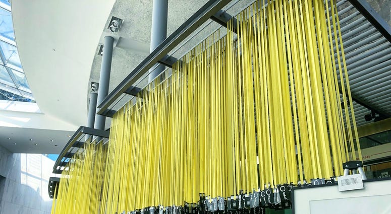Yellow ribbons for each of the 6,964 service members killed since 9/11 hang in the Women In Military Service For America Memorial in Arlington National Cemetery as part of Mindful Memorial Day, alongside artifacts, photos and art of women veterans. MindfulMemorialDay3