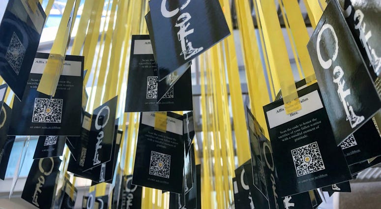 6,964 yellow ribbons hang in the women's memorial at Arlington National Cemetery -- one for each service member killed since 9/11/ MindfulMemorialDay6