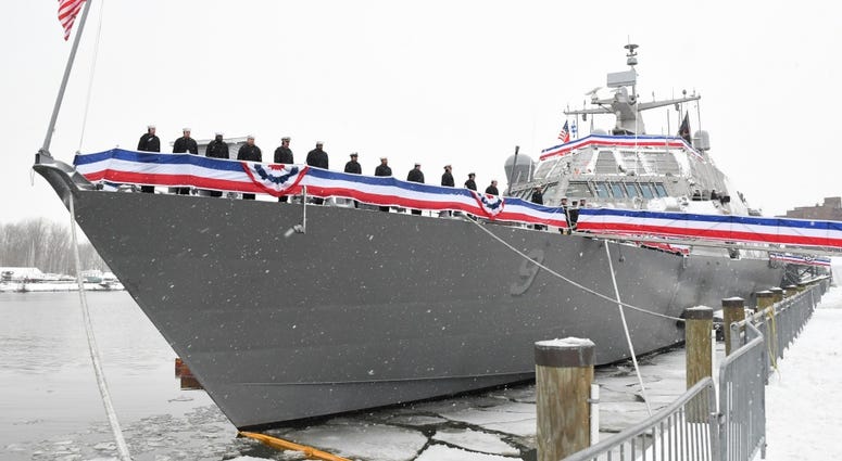 The Blue crew of the freedom variant littoral combat ship USS Little Rock (LCS 9) man the rails during the ship's commissioning ceremony Dec. 16, 2017 in Buffalo, N.Y. little rock