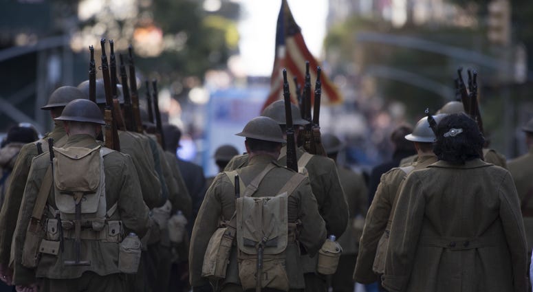 Historical reenactors representing U.S. Soldiers and Marines during a World War I, march in a Veterans Day Parade in New York City, N.Y., Nov. 11, 2017