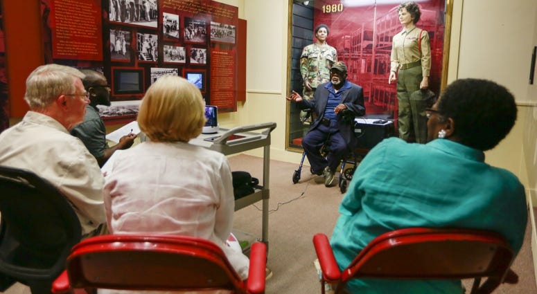 John White, a 93-year-old World War II Veteran, tells interviewers his story of serving in the Marine Corps in the South Pacific. White was one of over twenty veterans interviewed by members of the Veterans History Project