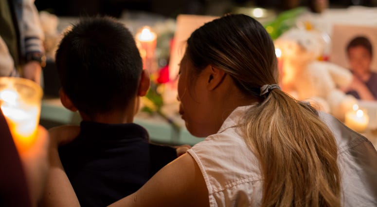 Family members of the late Peter Wang attend the vigil honoring the 17 lives lost at the school shooting in Parkland, Florida. wang