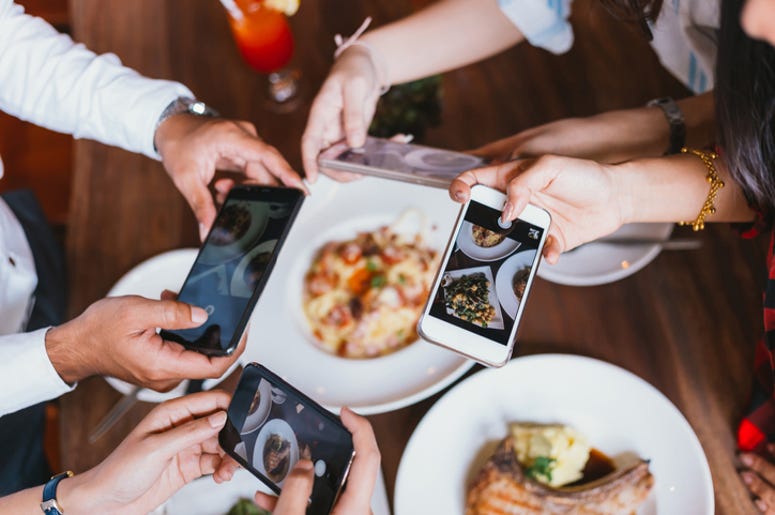Mobile Phone, Food, Group of friends going out and taking a photo of Italian food together with mobile phone.