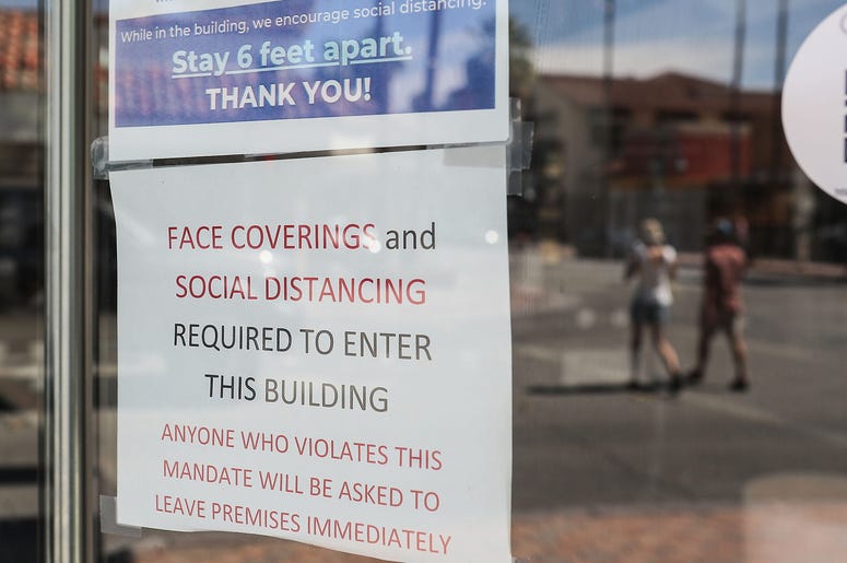 A sign explains the new rules at Lulu California Bistro in Palm Springs, June 12, 2020. A sign explains the new rules at Lulu California Bistro in Palm Springs, June 12, 2020.