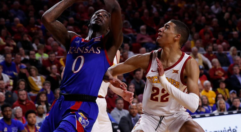 Photo of a Kansas player going up for a dunk.