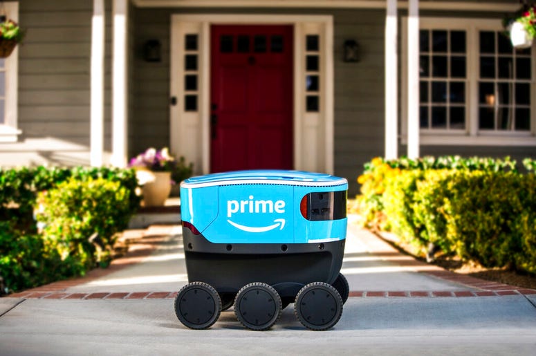 This undated photo provided by Amazon shows a self-driving delivery robot that Amazon is calling Scout. Amazon is expanding the use of its self-driving delivery robots to a second state. The online shopping giant says the six-wheeled robots, about the siz